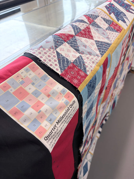 Quarter Millennial Quilt Label